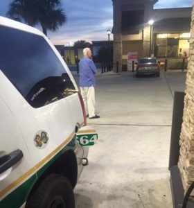 Elderly man acts as bodyguard as cop pumps gas