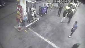 In this surveillance video frame released by Brazilian police, swimmers from the U.S. Olympic team appear with Ryan Lochte (right) at a gas station last weekend. A top Brazil police official said the swimmers damaged property at the gas station.