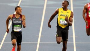 RIO DE JANEIRO, BRAZIL - AUGUST 17: Andre de Grasse of Canada (L) and Usain Bolt of Jamaica (2nd-L) react as they compete in the Men's 200m Semifinals on Day 12 of the Rio 2016 Olympic Games at the Olympic Stadium on August 17, 2016 in Rio de Janeiro, Brazil. (Photo by Ian Walton/Getty Images)