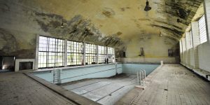 TO GO WITH AFP STORY BY JEROME RASETTI View of the swimming pool in the 1936 Olympic village in Elstal, west of Berlin on May 5, 2008. The village, which housed over 4.000 athletes for the notorious 1936 Olympic Games in Berlin, then under Nazi rule, was used as barracks for the German army shortly afterwards, and from 1945 as barracks for Russian officers, until the Russian army's final withdrawal in 1992. AFP PHOTO JOHN MACDOUGALL (Photo credit should read JOHN MACDOUGALL/AFP/Getty Images)