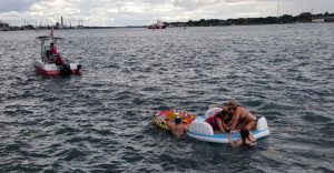A Canadian Coast Guard ship tows floatation devices used by U.S. partiers to the Canadian side of the St. Clair River between Michigan and Ontario on August 21, 2016. About 1,500 Americans ended up in Canada after getting hit by strong wind and rain. Canadian Coast Guard/Handout via Reuters ATTENTION EDITORS - THIS IMAGE WAS PROVIDED BY A THIRD PARTY. EDITORIAL USE ONLY - RTX2MLUJ