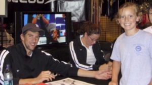 10 years ago: A 9-year-old named Katie Ledecky gets an autograph from Michael Phelps (Credit: Ledecky Family)