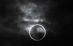 An annular solar eclipse is visible from Machida, on the outskirts of Tokyo, Monday, May 21, 2012. The annular solar eclipse, in which the moon passes in front of the sun leaving only a golden ring around its edges, was visible to wide areas across the continent Monday morning. (AP Photo/Itsuo Inouye)