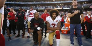 SAN DIEGO, CA - SEPTEMBER 1: Eric Reid #35 and Colin Kaepernick #7 of the San Francisco 49ers kneel on the sideline during the anthem, as free agent Nate Boyer stands, prior to the game against the San Diego Chargers at Qualcomm Stadium on September 1, 2016 in San Diego, California. The 49ers defeated the Chargers 31-21. (Photo by Michael Zagaris/San Francisco 49ers/Getty Images)